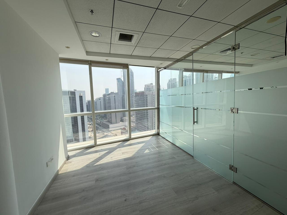 Fully fitted office space with glass partitions and canal views for rent in B2B Tower, Business Bay