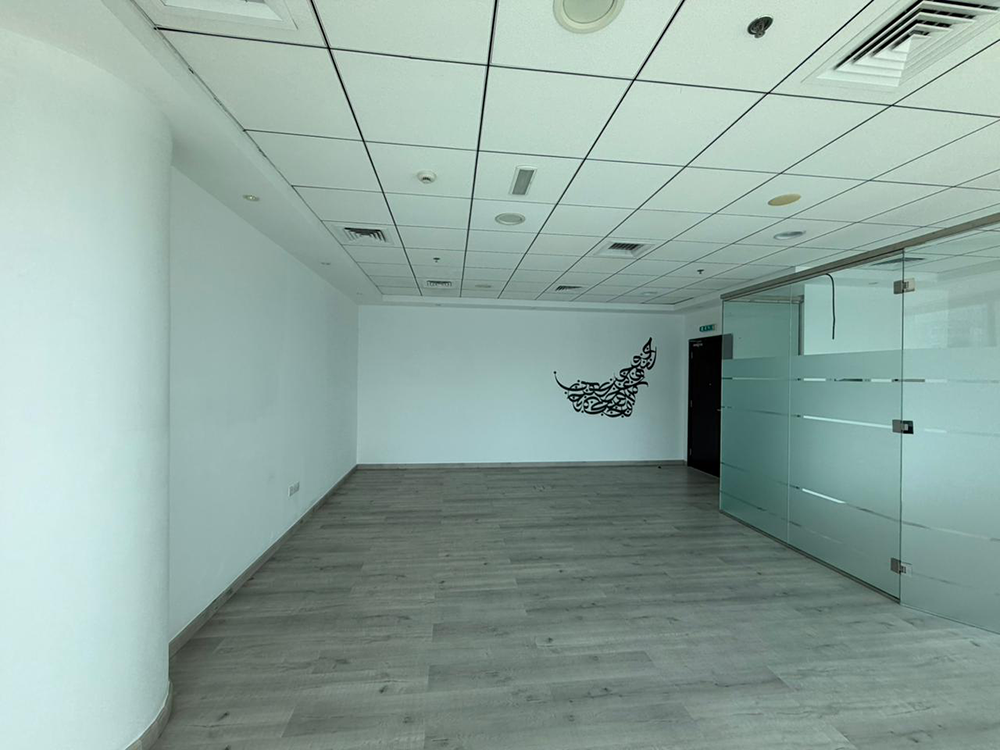 Fully fitted office space with glass partitions and canal views for rent in B2B Tower, Business Bay