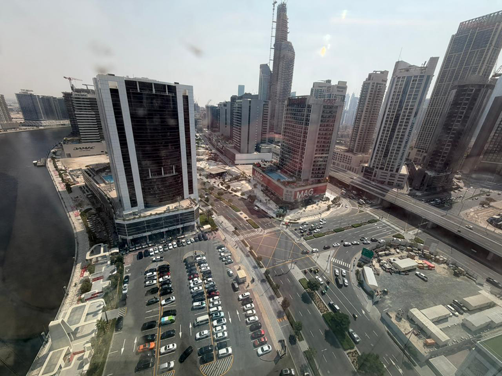 Fully fitted office space with glass partitions and canal views for rent in B2B Tower, Business Bay