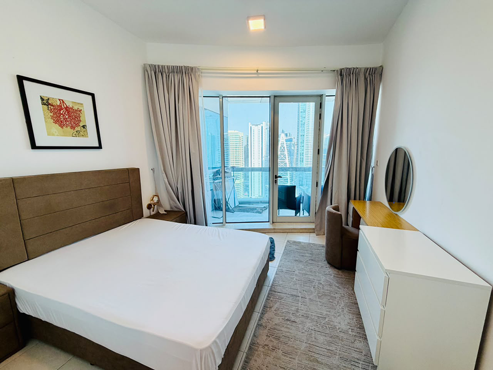 Bright bedroom with large windows